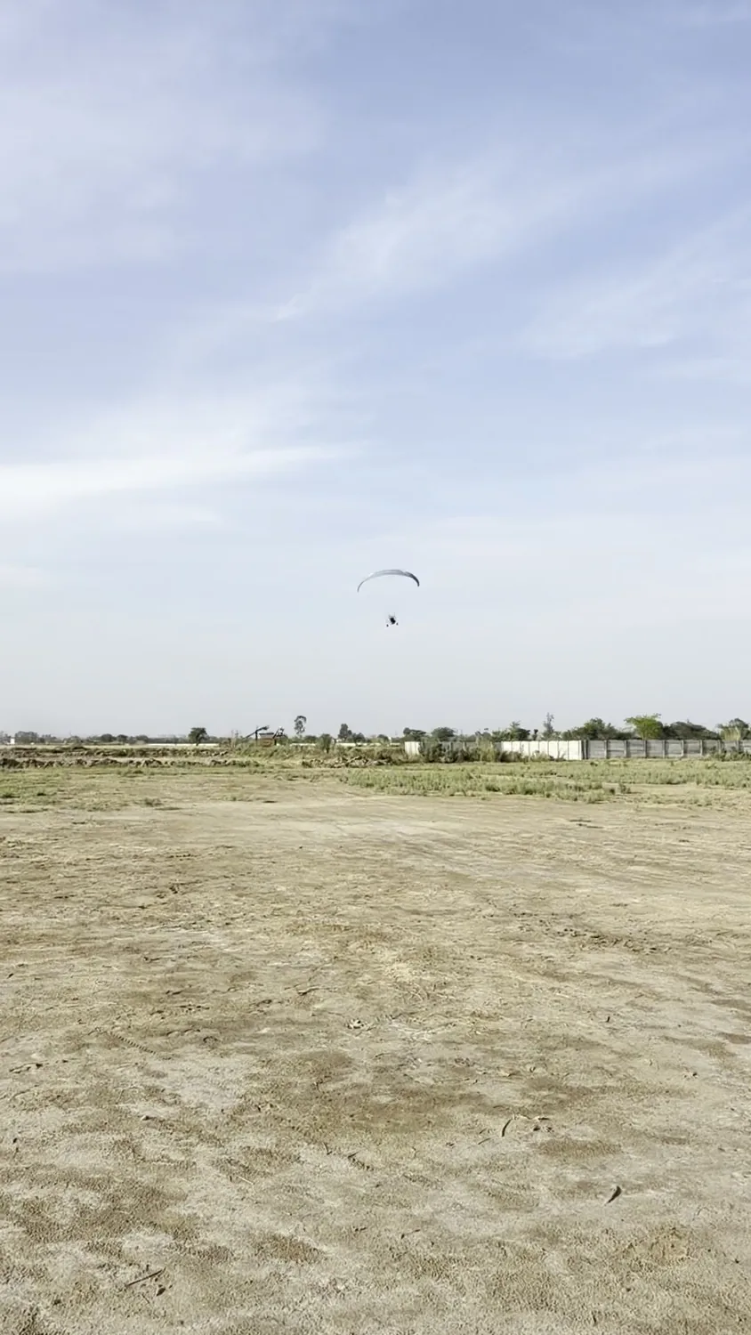 Open landing field after a motor paragliding activity