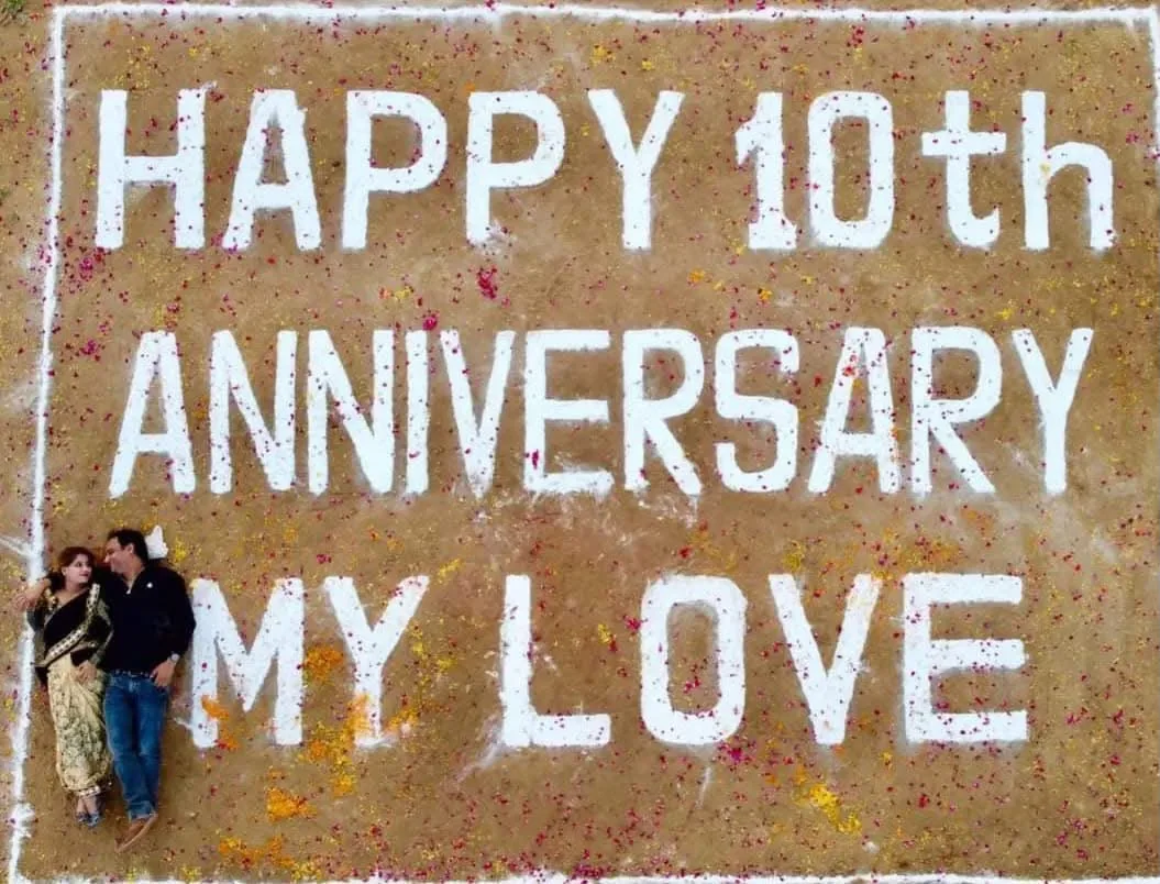 Happy 10th anniversary message prepared on an open field