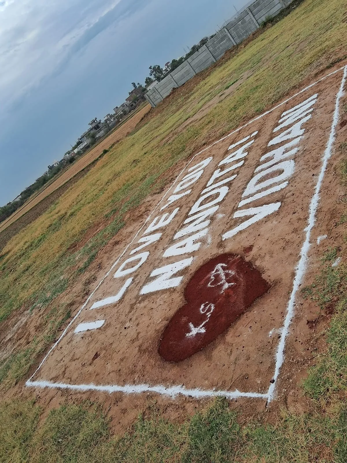 Love message and heart design prepared on an open field